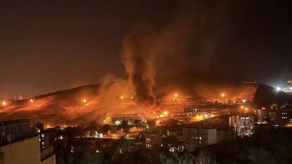 Tehran's notorious Evin Prison with fires burning inside the sprawling complex on October 15, 2022