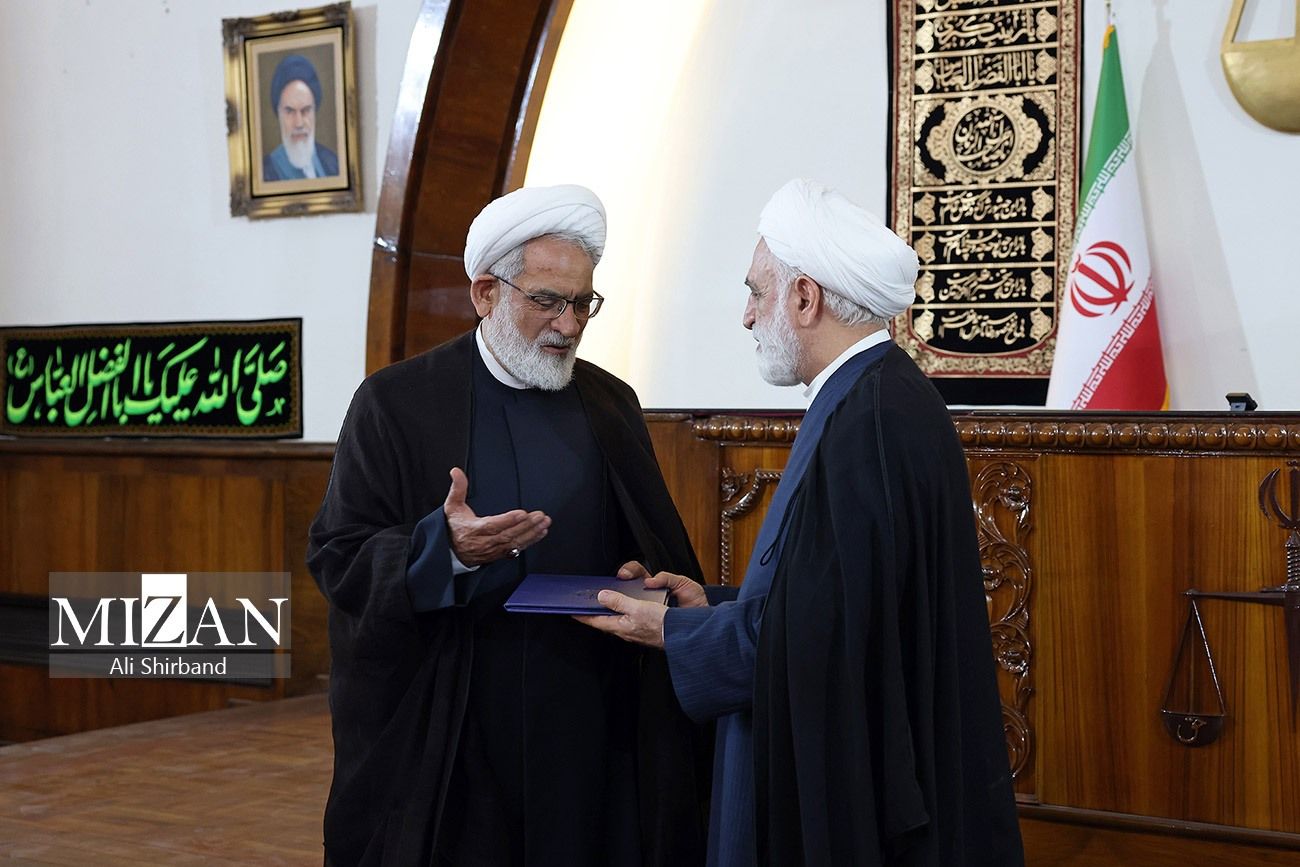 Iran's Chief Justice Gholamreza Mohseni-Ejei (right) former prosecutor general Mohammad-Jafar Montazeri during a ceremony in Tehran on August 6, 2023  