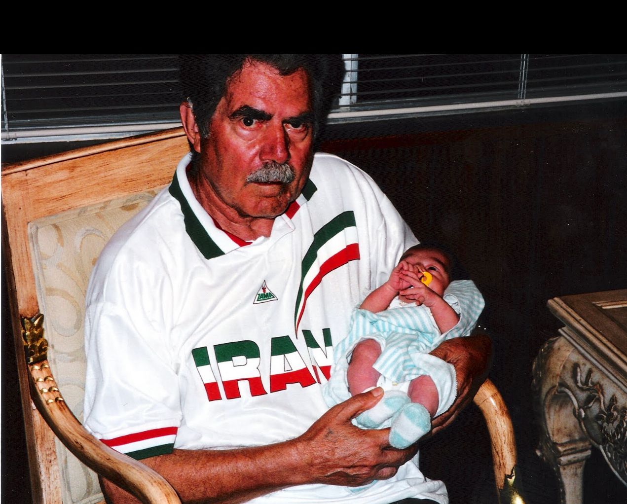 Author's father Ghazanfar Bazargan in 1998, with her 5-day old granddaughter