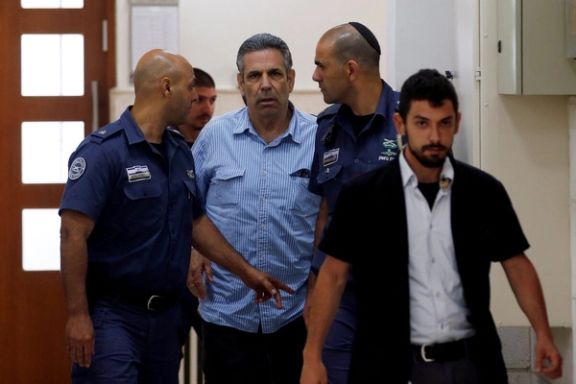 Gonen Segev, a former Israeli cabinet minister indicted on suspicion of spying for Iran, is escorted by prison guards as he arrives to court in Jerusalem, July 5, 2018