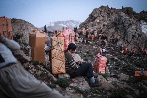A group of Iranian cross-border porters, known as Kolbars