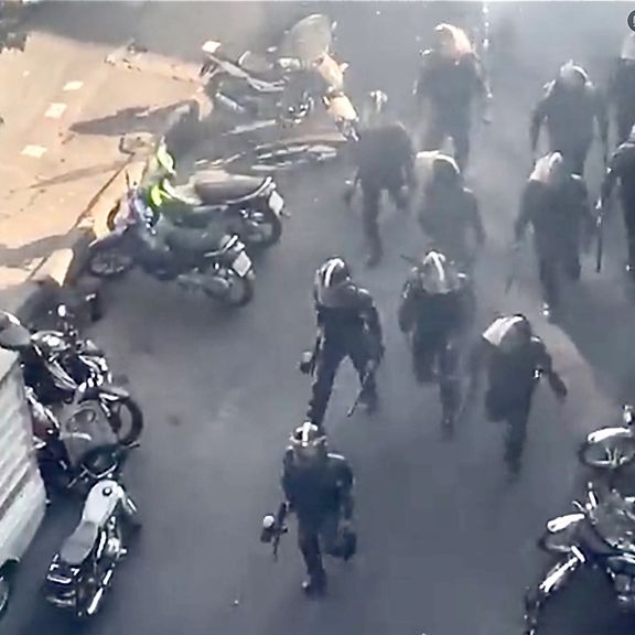 Iranian anti-riot troops in action against protesters in Tehran on October 12, 2022