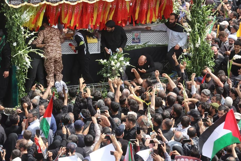 Iranians gather for the funeral procession of assassinated Hamas chief, Ismail Haniyeh in Tehran, Iran, August 1, 2024. 