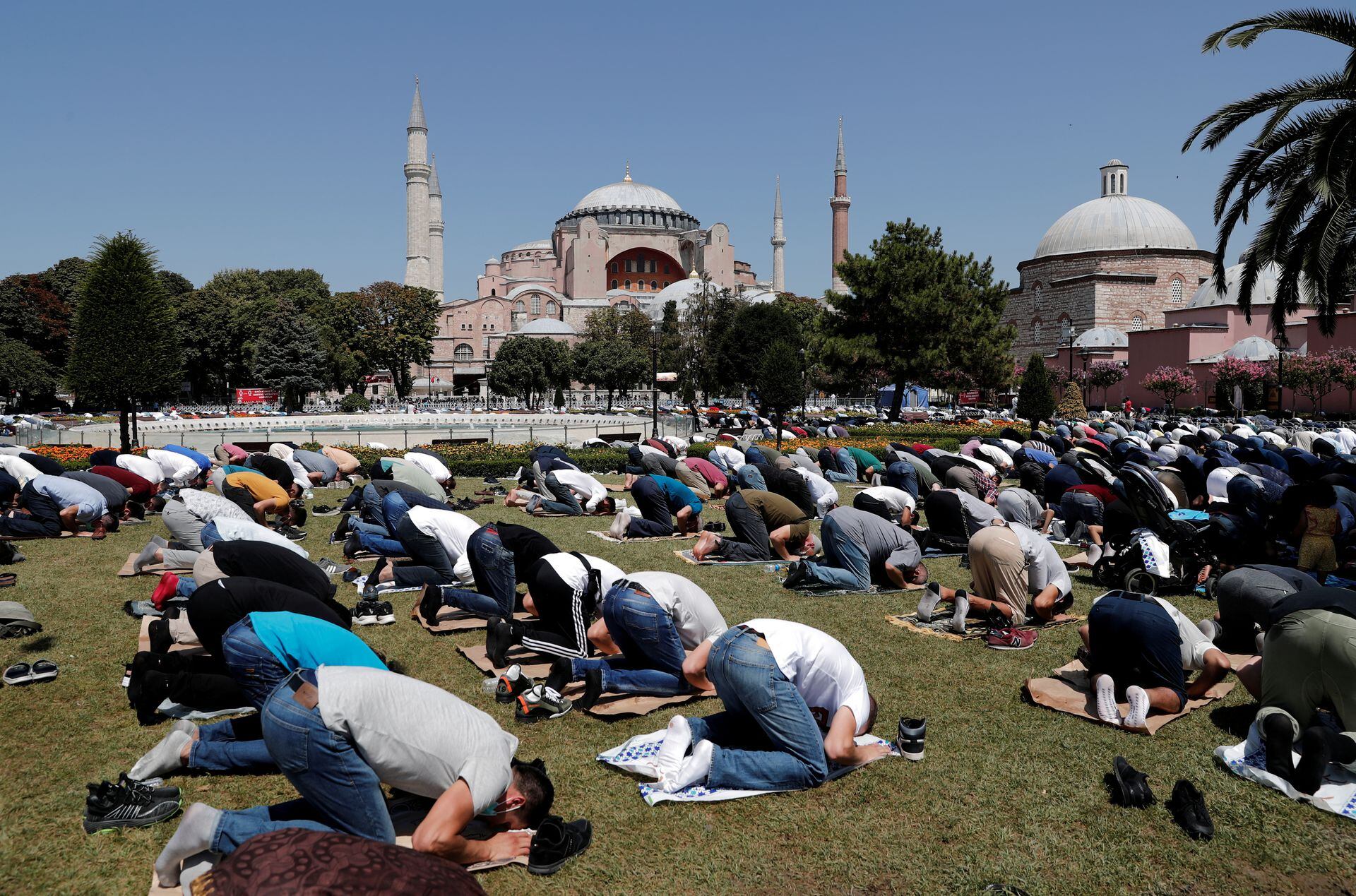 Worshippers attend Friday prayers outside Hagia Sophia Grand Mosque in Istanbul, Turkey August 7, 2020.