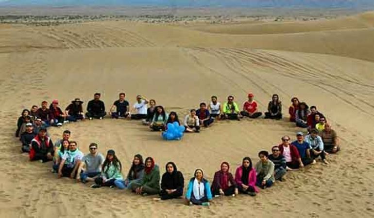 A grup of Iranians during a desert tour. Undated