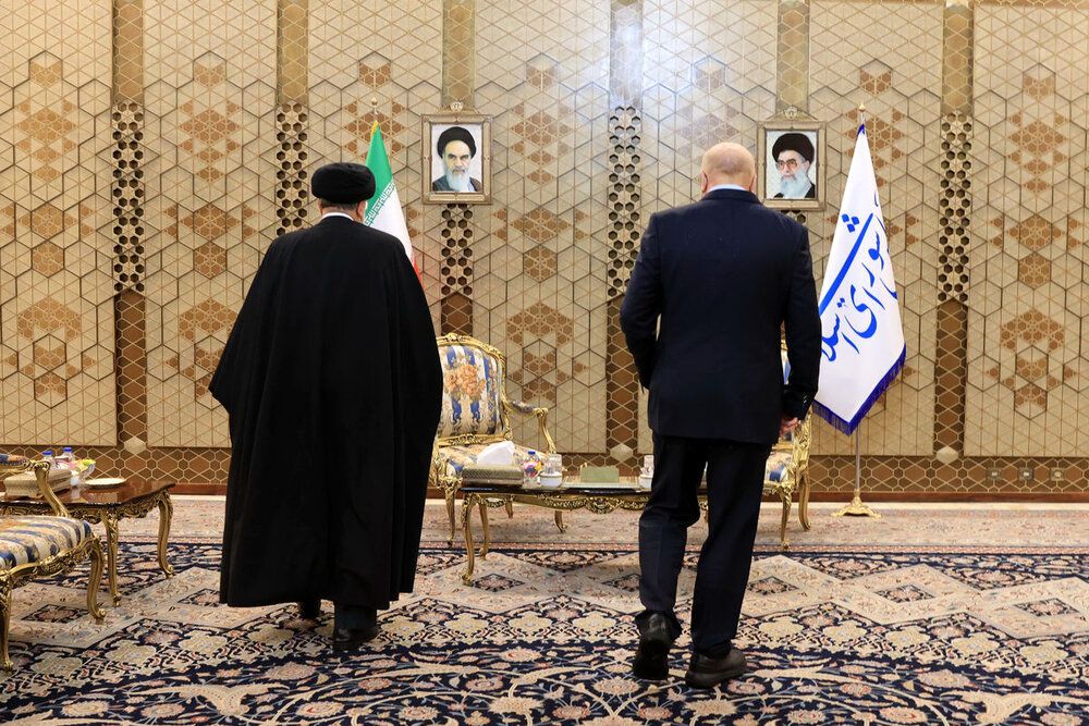 Iran’s President Ebrahim Raisi (left) and Parliament Speaker Mohammad Bagher Ghalibaf  