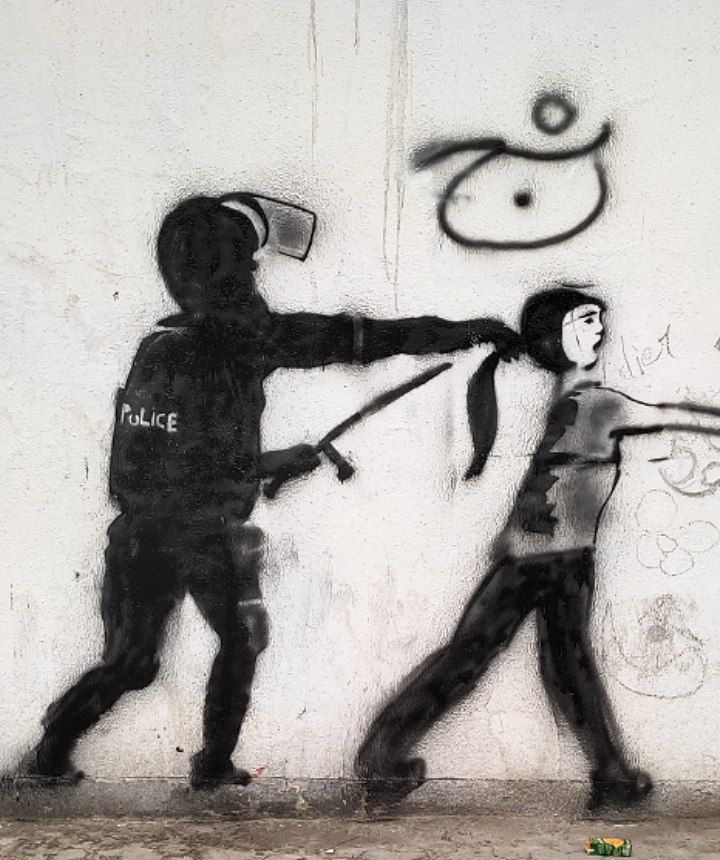 A graffiti against the crackdown on women who defy mandatory hijab     