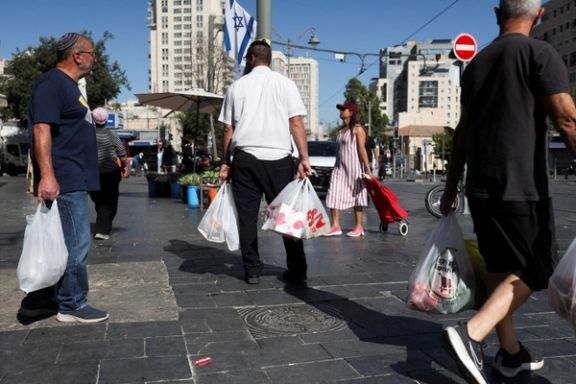 People shop in the main market as Israelis prepare against retaliation by Iran following an Israeli strike, in Jerusalem, June 13, 2025.