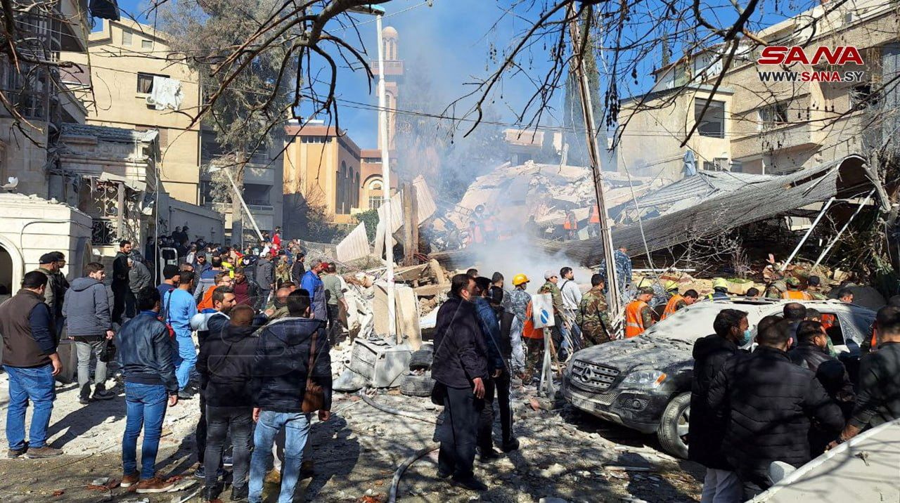 People inspect the damage at the site of a suspected Israeli strike in Damascus, Syria January 20, 2024. 