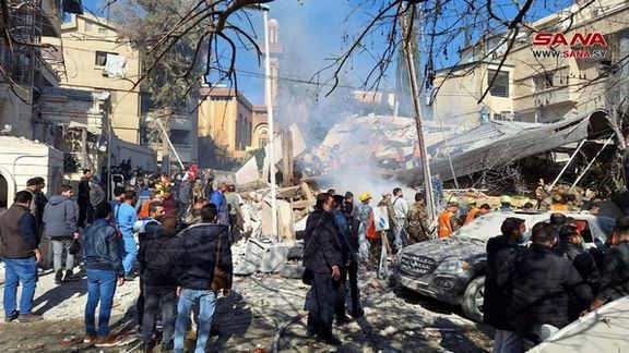People inspect the damage at the site of an Israeli strike, according to sources, in the Mazzeh neighborhood of Damascus, Syria January 20, 2024.
