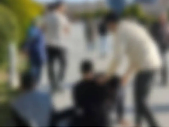 A blurred frame grab from the footage of the encounter between people and a hijab enforcer in Esfahan (March 2024)