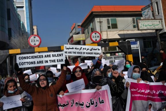 Afghan women shout slogans during a rally to protest against what the protesters say is Taliban restrictions on women, in Kabul, Afghanistan, December 28, 2021.