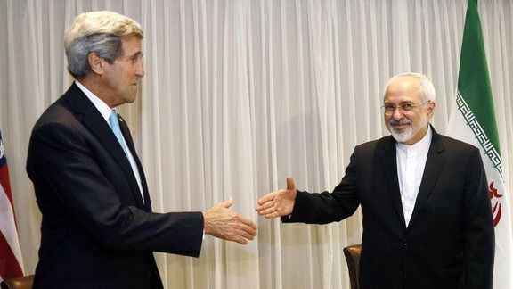 Former US Secretary of State John Kerry shakes hands with former Iranian Foreign Minister Mohammad Javad Zarif before a meeting in Geneva January 14, 2015.