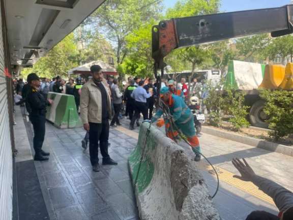 Security forces sealing down businesses which held a strike in Mashhad (May 2024)