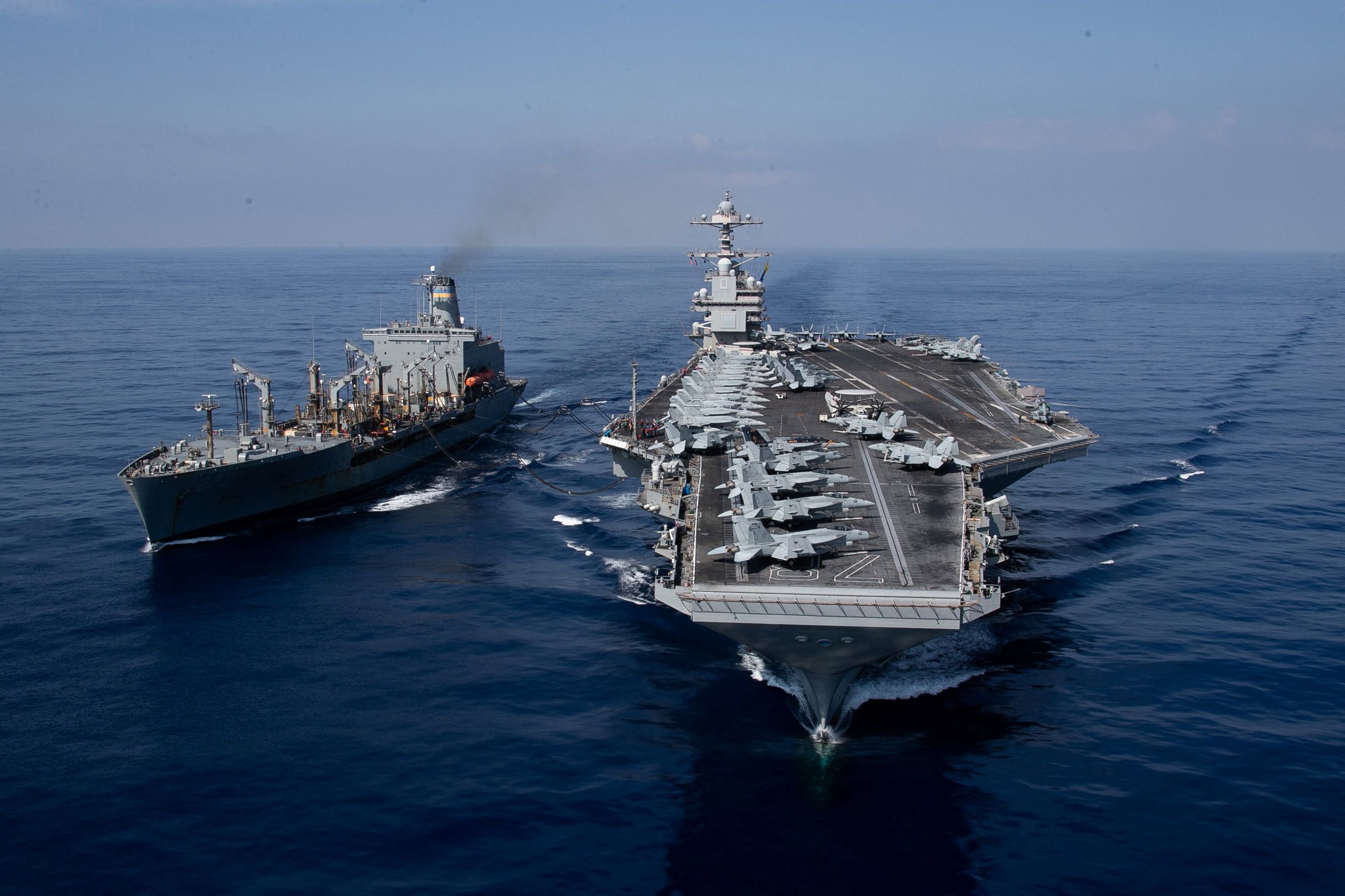 The world’s largest aircraft carrier USS Gerald R. Ford steams alongside USNS Laramie (T-AO-203) during a fueling-at-sea in the eastern Mediterranean Sea (October 11, 2023)