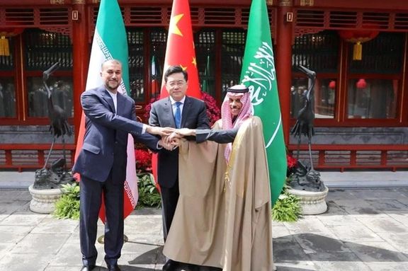 Iranian Foreign Minister Hossein Amir-Abdollahian and Saudi Arabia's Foreign Minister Prince Faisal bin Farhan Al Saud and Chinese Foreign Minister Qin Gang shake hands during a meeting in Beijing, China, April 6, 2023. I