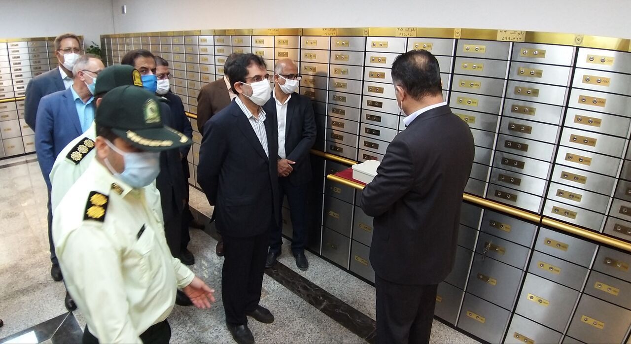 Officials and police inspect a section of safety deposit boxes at Bank Melli. (June 2022)