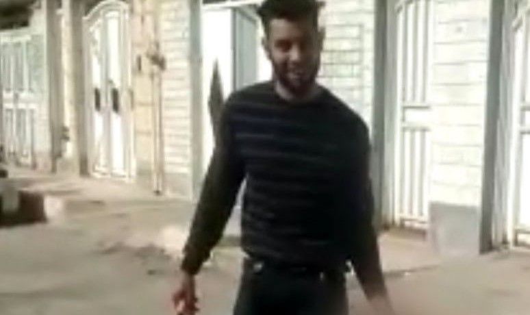 The husband who beheaded his wife smiling in a video, holding her head in one hand and a large knife in another.