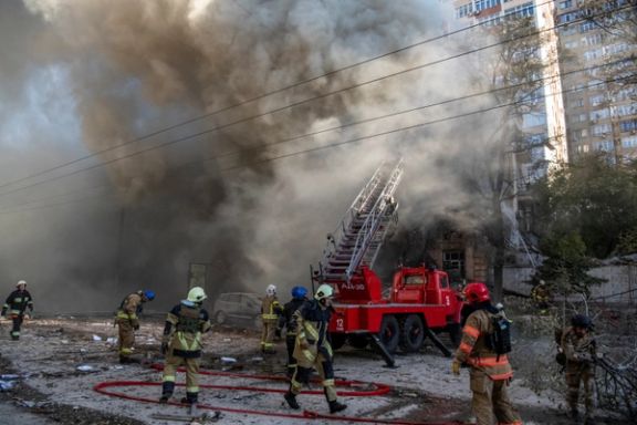 Firefighters evacuating people from a residential building destroyed by a Russian drone strike, which local authorities consider to be Iranian-made unmanned aerial vehicles (UAVs) Shahed-136, in Kyiv, Ukraine October 17, 2022