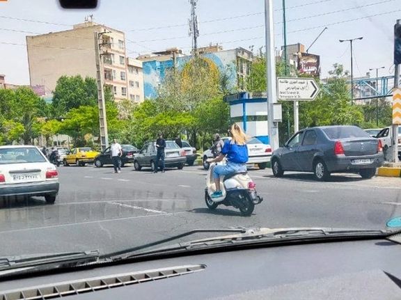 An Iranian woman riding a motorcycle in Tehran