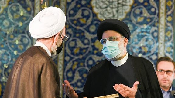President Ebrahim Raisi handing out Quran awards last week, while critics demand management of the economy.