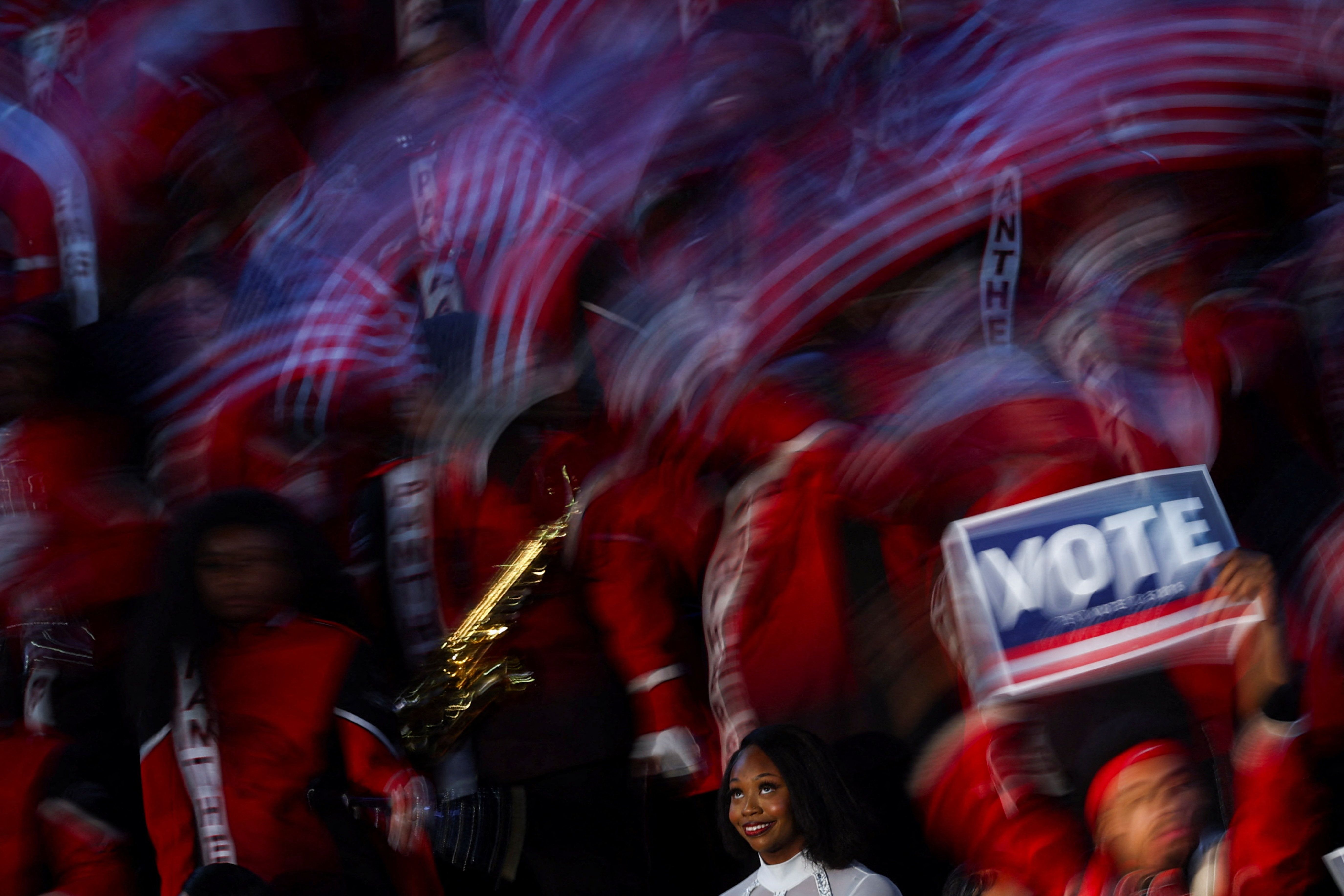Supporters wave US flags as they attend a rally ahead of the midterm elections in Morrow, Georgia, on October 28, 2026. 