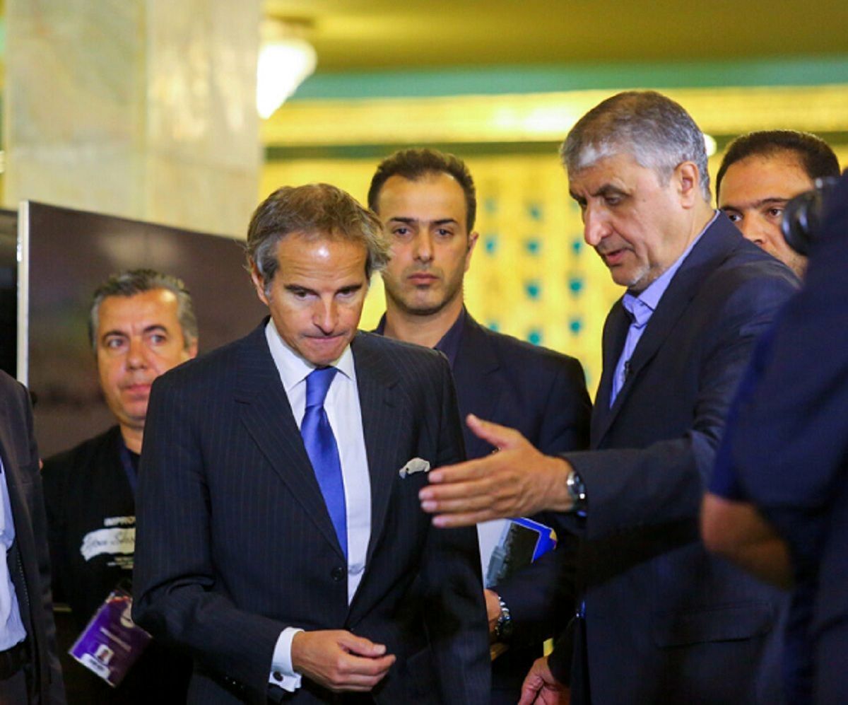 Head of the Atomic Energy Organization of Iran Mohammad Eslami (R) and International Atomic Energy Agency (IAEA) chief Rafael Grossi 