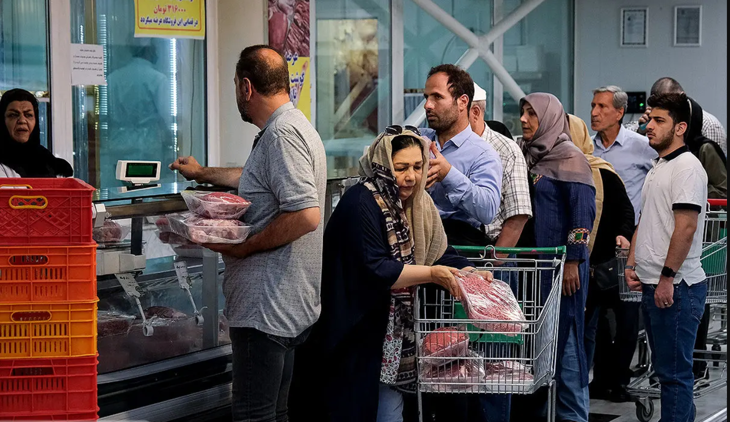 Shoppers queue at a butcher’s counter in Iran as food costs continue to climb.