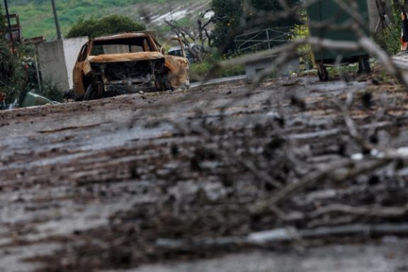 A burnt car lies abandoned on the road of a town, amid ongoing cross-border hostilities between Hezbollah and Israeli forces, near Israel’s border with Lebanon in northern Israel March 19, 2024.