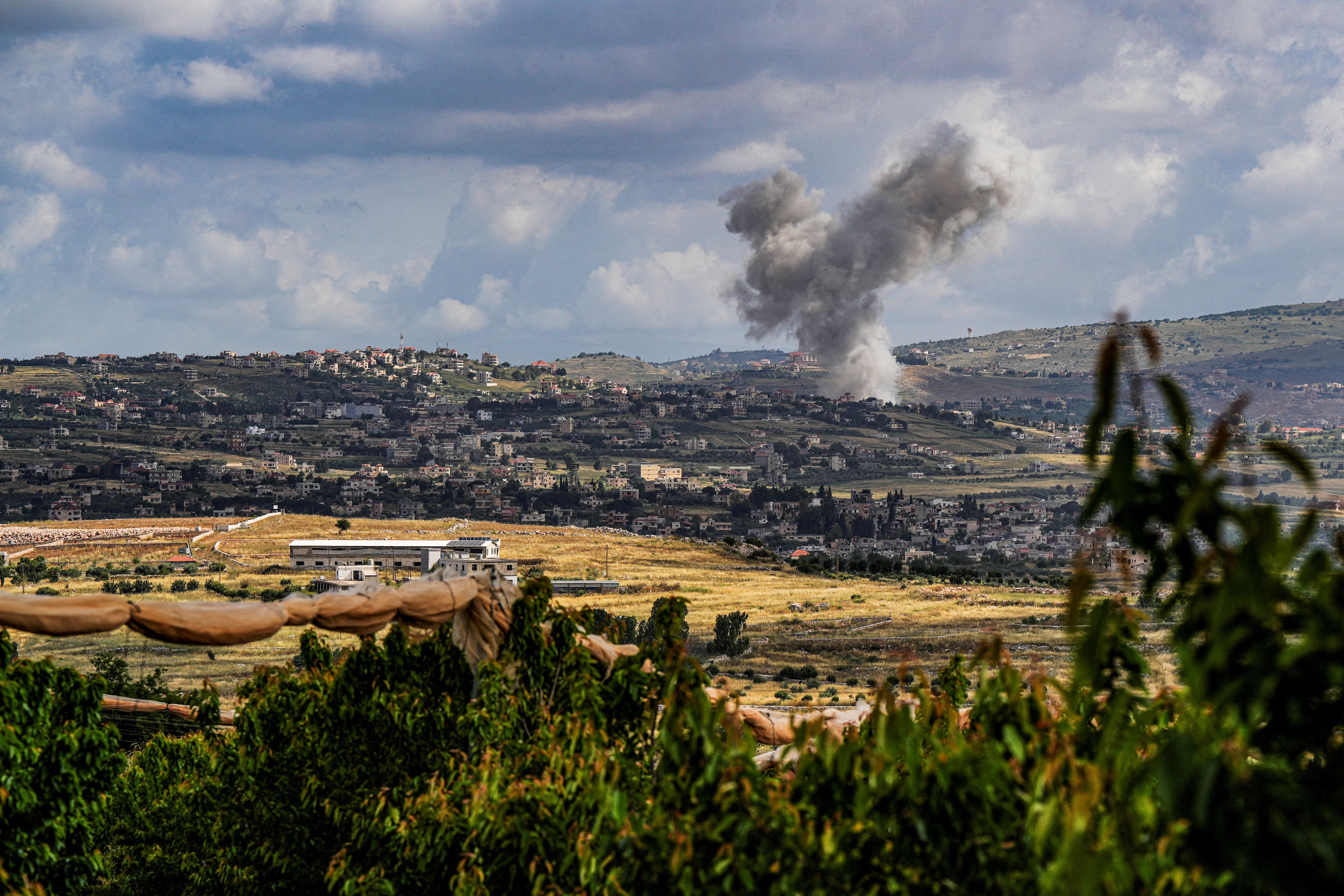 Smoke rises above south Lebanon following an Israeli strike amid ongoing cross-border hostilities between Hezbollah and Israeli forces, as seen from Israel's border with Lebanon in northern Israel, May 5, 2024. 