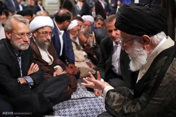 Former parliament Speaker Ali Larijani (left) and Supreme Leader Ali Khamenei (right) during a meeting (undated)