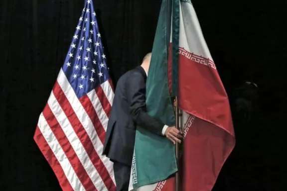 Iranian and US flags next to each other in 2015 when the JCPOA was finaized