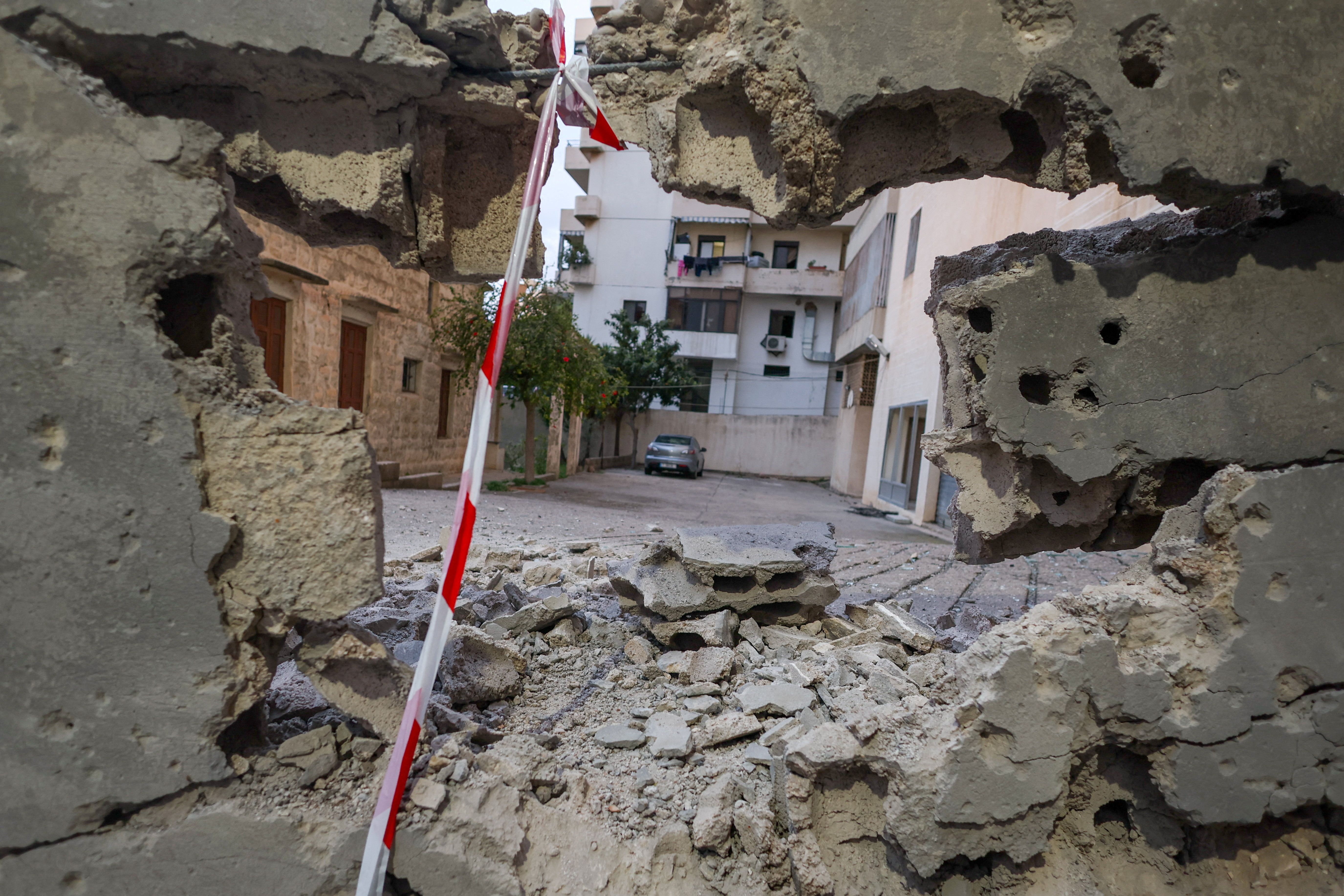 A hole in a wall, after shrapnel from an intercepted Iranian missile made impact in Sahel Alma, a Christian town north of Beirut, Lebanon, according to Lebanese sources, amid escalating hostilities between Israel and Hezbollah, as the US-Israeli conflict with Iran continues, March 24, 2026