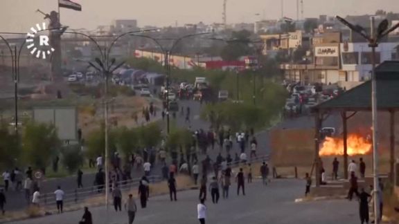 A fire blazes as protesters take to the streets during clashes between ethnic groups in Kirkuk, Iraq September 2, 2023 in this still image from video.