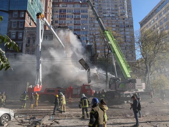 Firefighters evacuating people from a residential building destroyed by a Russian drone strike, which local authorities consider to be Iranian-made unmanned aerial vehicles (UAVs) Shahed-136, Kyiv, October 17, 2022
