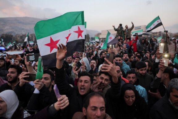 Syrians celebrate the fall of Bashar al-Assad on December 12, 2024.