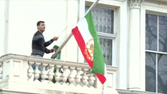 Protester replaces Islamic Republic flag at Iran embassy in London