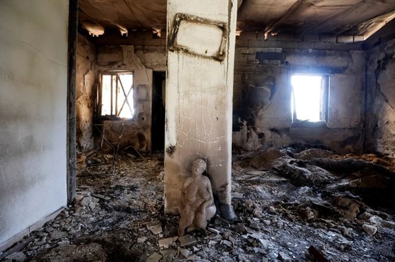 A view shows a statue among the wreckage of a home, following a deadly infiltration by Hamas gunmen from the Gaza Strip, in Kibbutz Kissufim in southern Israel October 7, 2023.