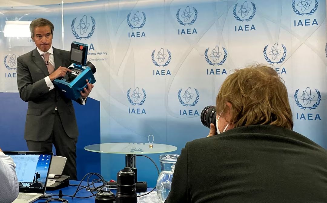  IAEA Director General Rafael Grossi presents a surveillance camera in Vienna, Austria, December 17, 2021. 