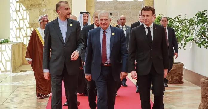 Iranian Foreign Minister Hossein Amir-Abdollahian (left), the High Representative of the European Union for Foreign Affairs and Security Policy Josep Borrell (center), and French President Emmanuel Macron arrive at the start of the "Baghdad Conference for Cooperation and Partnership" in Sweimeh by the Dead Sea shore in central-west Jordan on December 20, 2022. 
