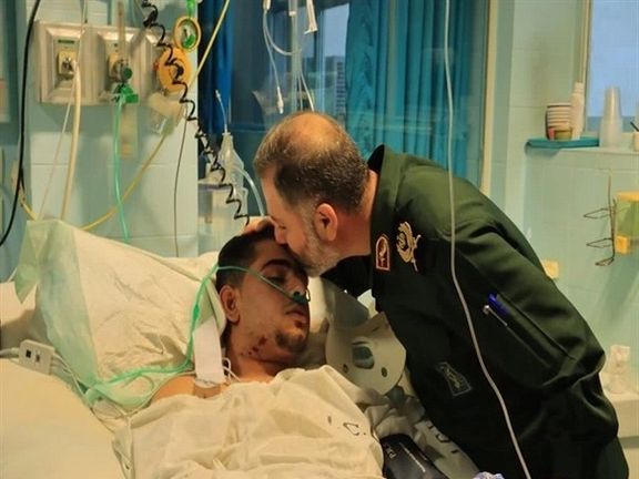 An Iranian IRGC commander visiting one of the agents injured during clashes with protesters