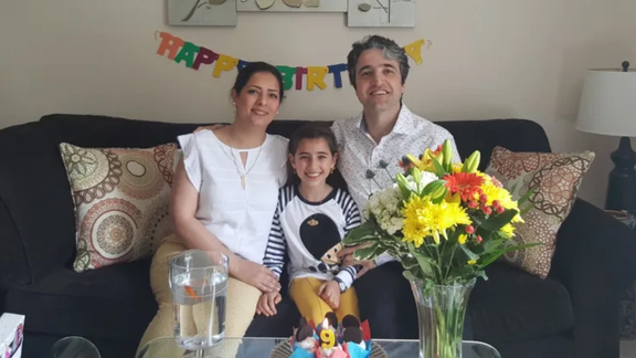 Hamed Esmaeilion with wife Parisa and daughter Reera on her ninth birthday.