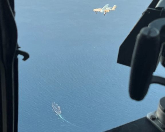 Photo released by US Navy on December 2, 2023 showing a drone over what appear to be US warships.