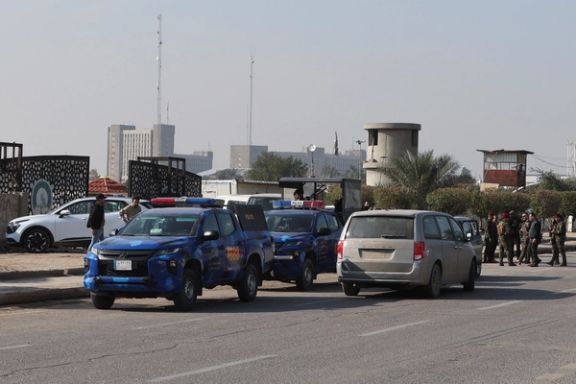 Iraqi security forces stand guard at a street after an attack by a drone strike on an Iran-backed militia headquarters in Baghdad, Iraq January 4, 2024.
