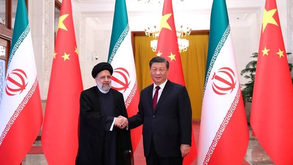 Iranian President Ebrahim Raisi shakes hands with Chinese President Xi Jinping during a welcoming ceremony in Beijing, China, February 14, 2023.