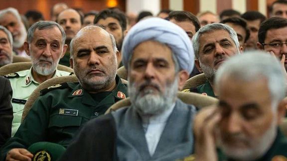 Undated phot of Ta'eb with Qasem Soleimani seen on the foreground