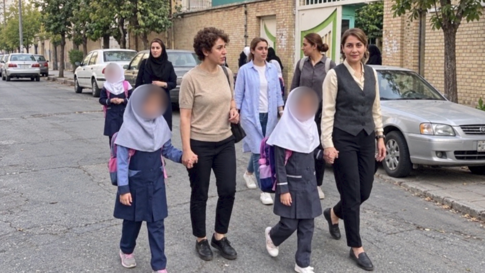 Bareheaded mother, veiled daughter: Iran's schools keep a rule its streets have dropped