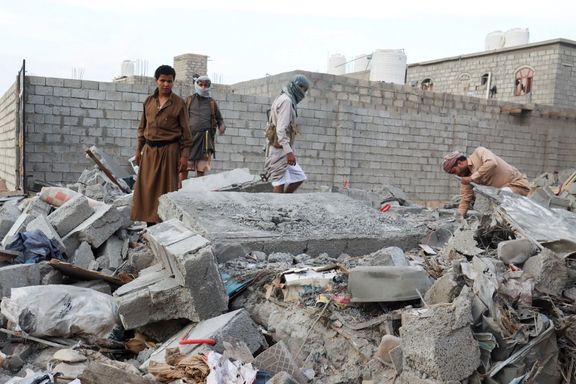 People browse through the rubble of a house destroyed by Houthi missile attack in Marib, Yemen, October 3, 2021