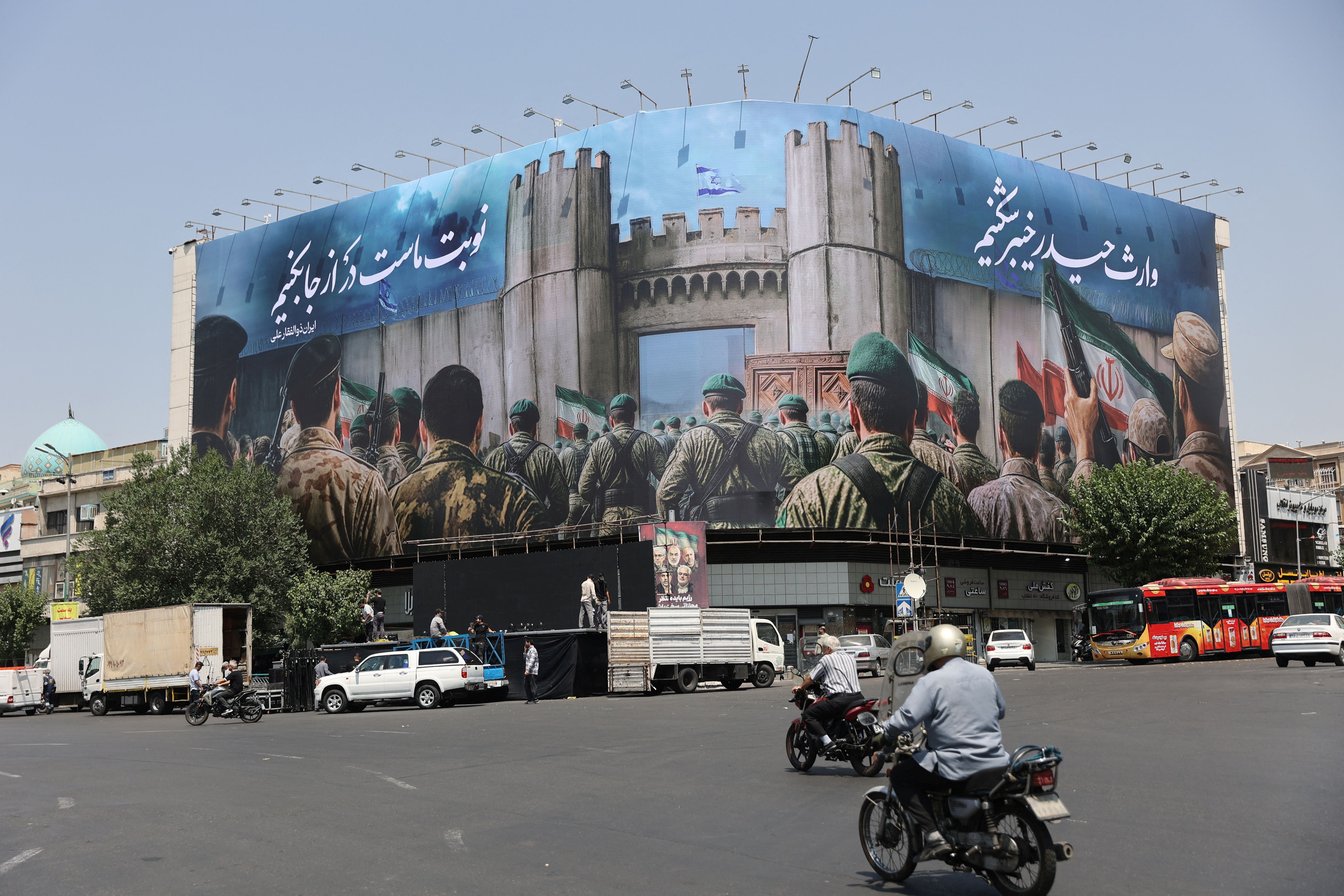 An anti-Israeli billboard is displayed following the Israeli strikes on Iran, in Tehran, June 14, 2025. 