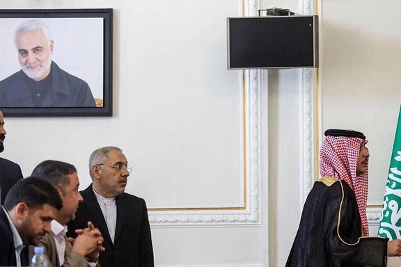 Saudi Arabia's Foreign Minister Prince Faisal bin Farhan Al Saud walking out of a conference room in protest to a picture of IRGC general Qassem Soleimani, Iran’s architect of proxy wars in the Middle East, Tehran, June 17, 2023